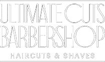 A green sign with white lettering that says ultimate cuts barbershop.